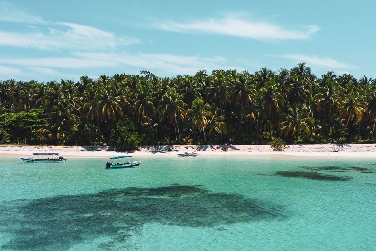a drone of blue water and blue sky at isla zapatilla in bocas del toro, panama