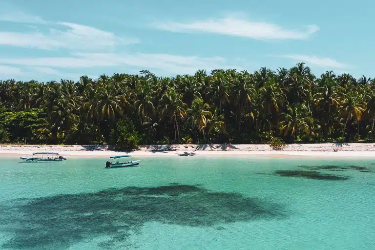 a drone of blue water and blue sky at isla zapatilla in bocas del toro, panama