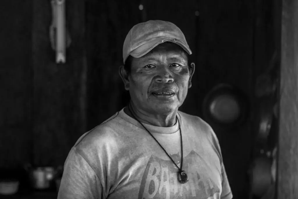 Rutilio Milton poses with a batman t shirt in black and white in Bahia Honda of Bocas del Toro Panama