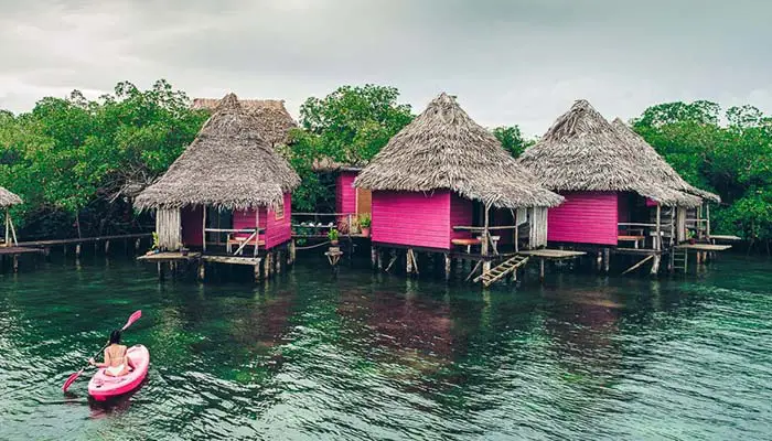 rustic and cheap overwater bungalows in bocas del toro panama painted purple