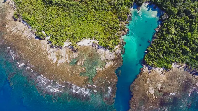 The drone's view of La Piscina reveals the lagoon and secret beach.