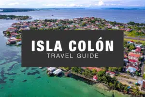 Isla Colon Travel Guide Cover image from the Bocas del Toro Blog with text over a background of Bocas Town