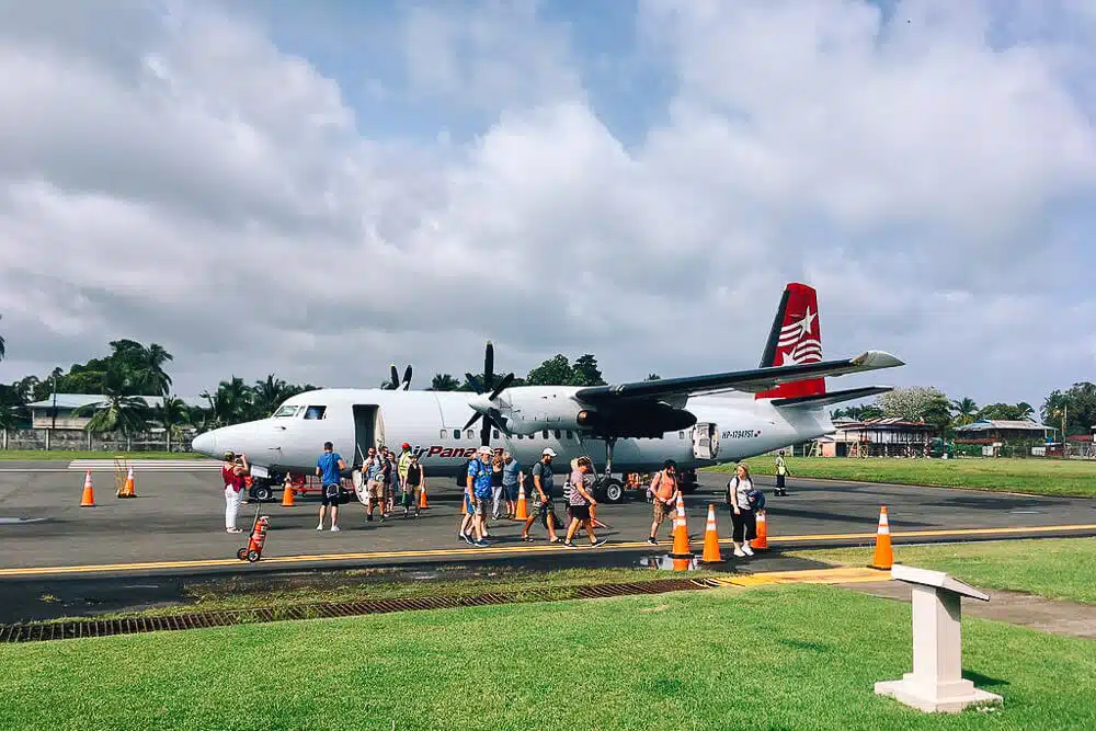 Air Panama Fokker 50 Airplane landed in Bocas del Toro with passengers unloading.