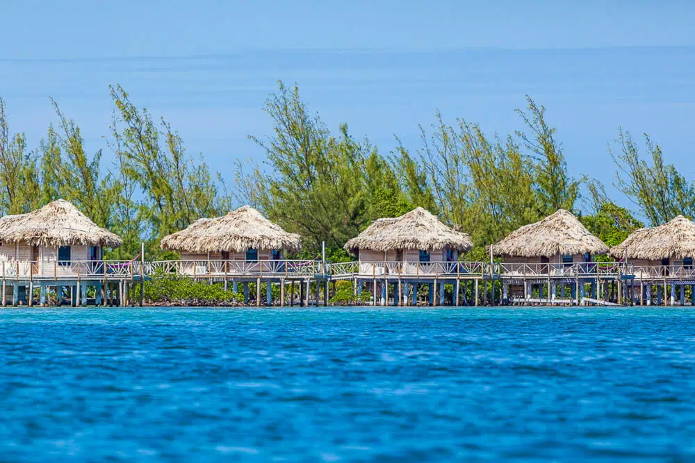 Thatch caye resort has rustic and affordable overwater bungalows in the Caribbean on a private island.