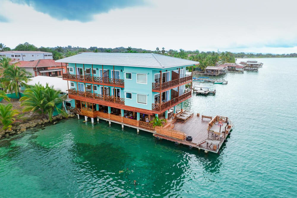 Bambuda Bocas Town is a turquoise painted overwater hotel. 